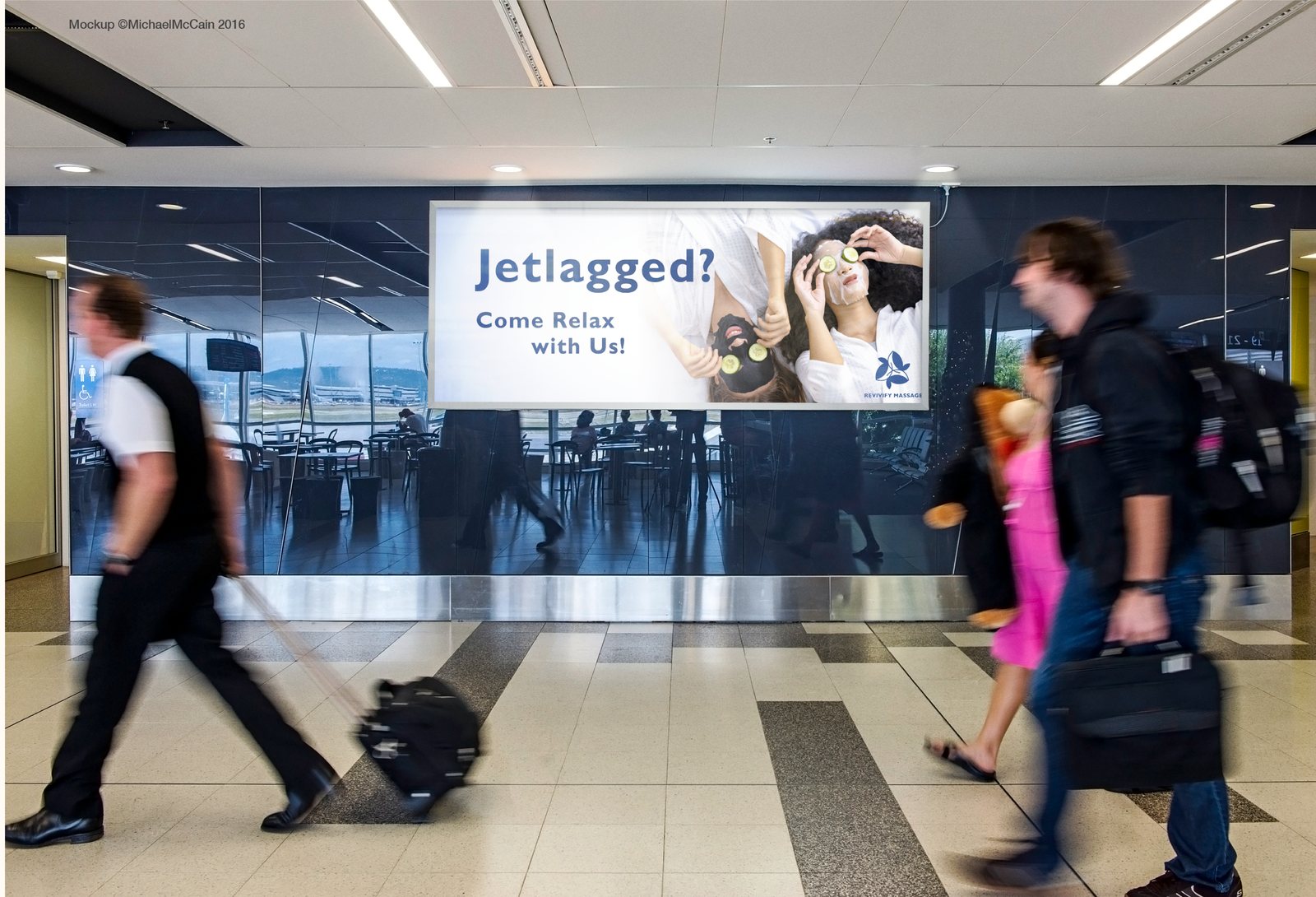 The “Jetlagged?” ad on a billboard in an airport concourse as travelers walk past with luggage
